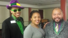 Three people posing for picture