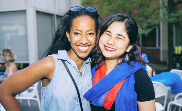 Two smiling students from CSDI at program.