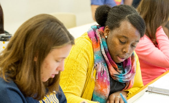 students in classroom sitting at desk