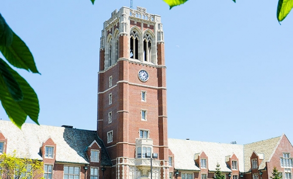 picture of clock tower with leaves