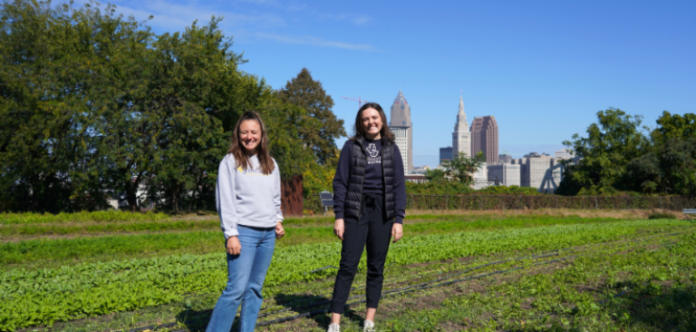 JCU students in front of Cleveland skyline