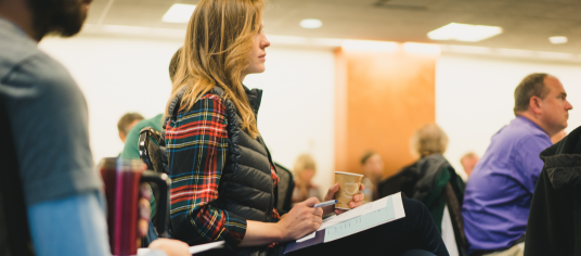 Woman sitting Theology for Teachers Workshop